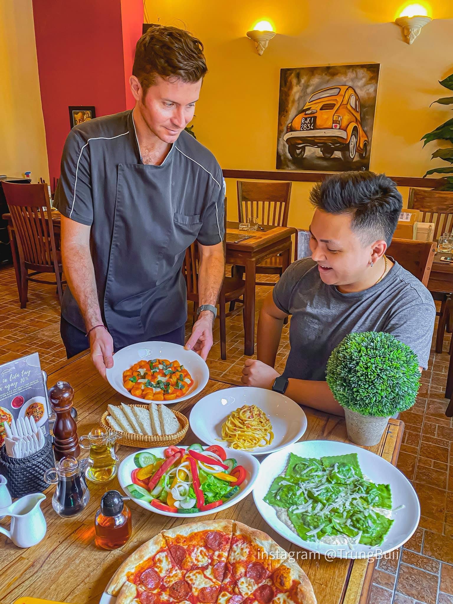 Chef Michele serving guests